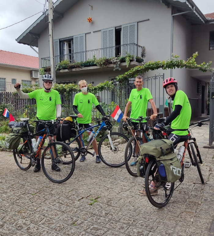 Image shows happy bikers at their destination, illustrating vocab word "triumph"